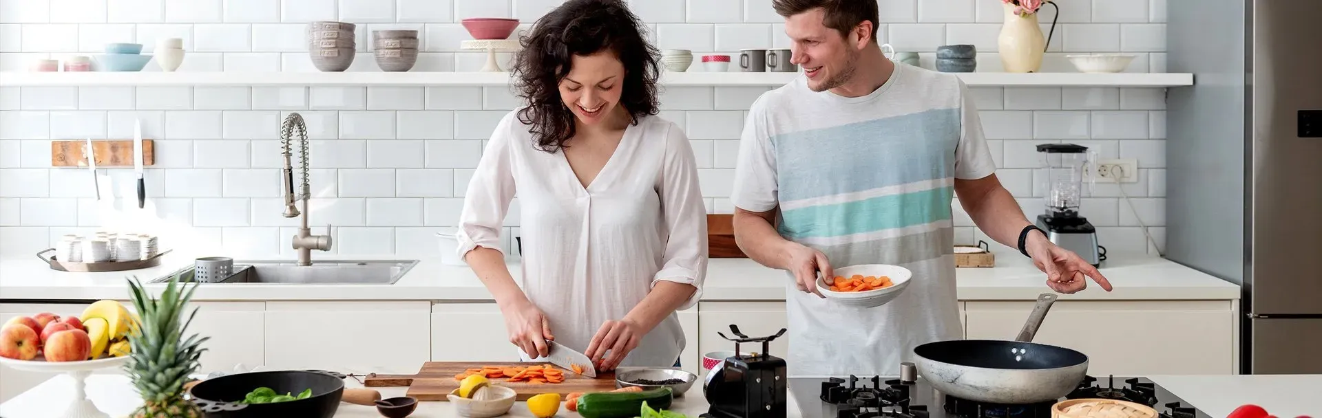 Jetson hero banner - a man and woman happily cooking together in modern kitchen